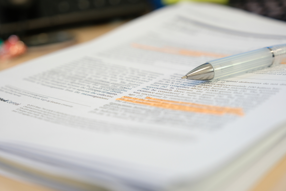 A stack of corporate documents waiting for document storage